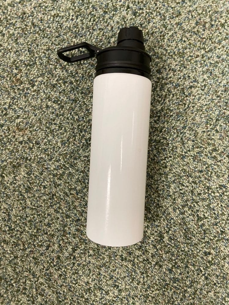 White sports bottle with black lid